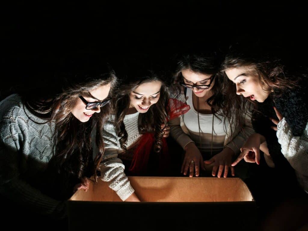 Teens Examining Open Box