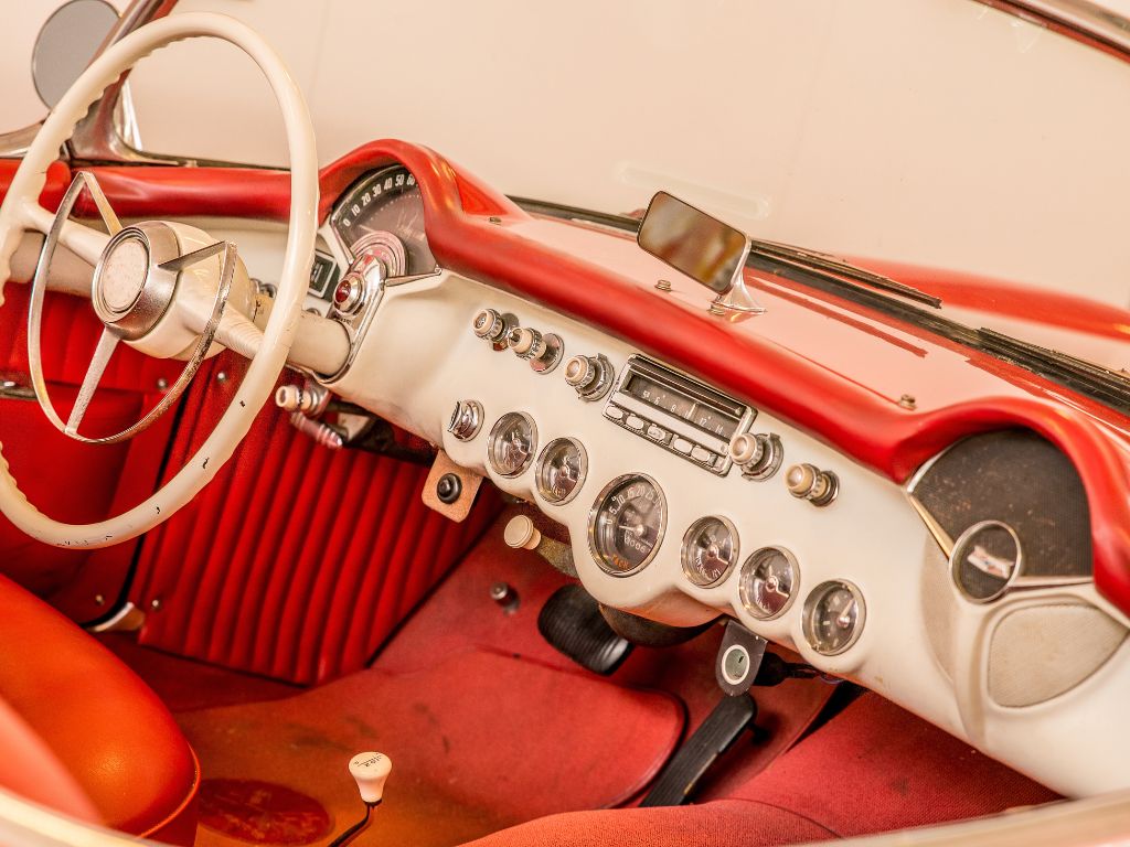 front part red interior car including white steering wheel