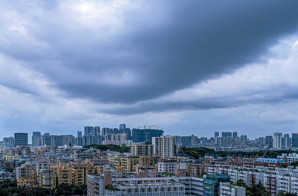 Dark monsoon clouds gathering over the Hyderabad city skyline, ideal weather for indoor rainy day activities in Hyderabad like Lock N Escape
