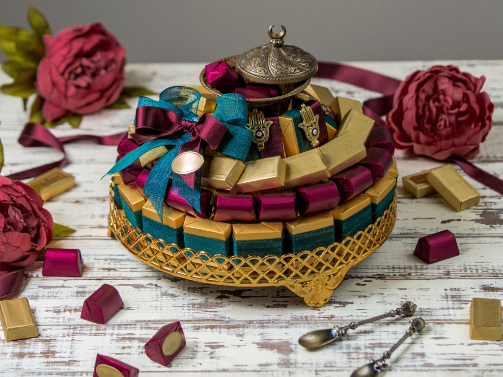Elegant two-tier chocolate and sweet gift box with gold ribbon and floral decor, a premium designer rakhi hamper gift idea in Hyderabad from Lock N Escape