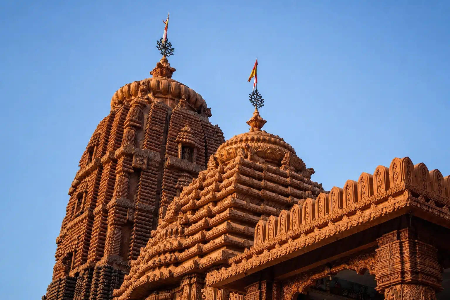 Carved temple spires against a blue sky